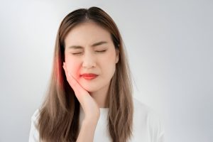 Dentist performing tooth extraction in Peterborough