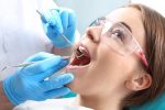 Dental hygienist performing teeth cleaning in Peterborough